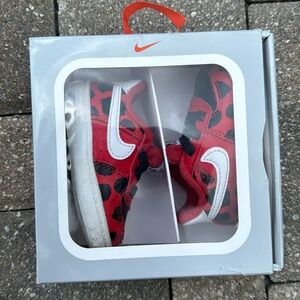 Nike size 2c, comes with box. Red white and black